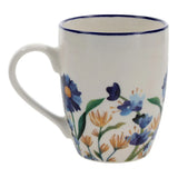 White mug with floral design on a white background
