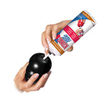 KONG Black Extreme Dog Treat Toy being filled with treats