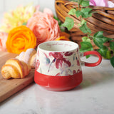 Floral Red Double Mould Christian Ceramic Mug on a table with croissants
